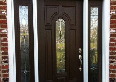 Gorgeous custom front door millwork and installation by Ricco Builders